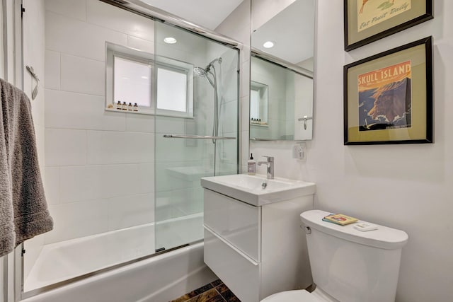bathroom with toilet and vanity