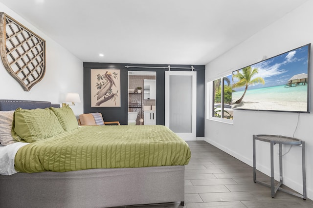bedroom featuring baseboards, recessed lighting, and wood finished floors