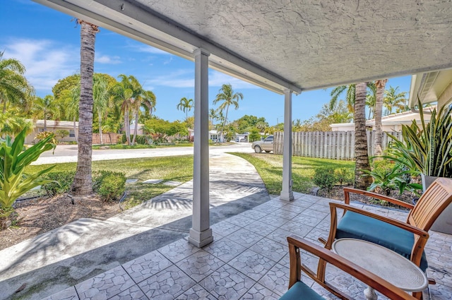 view of patio featuring fence
