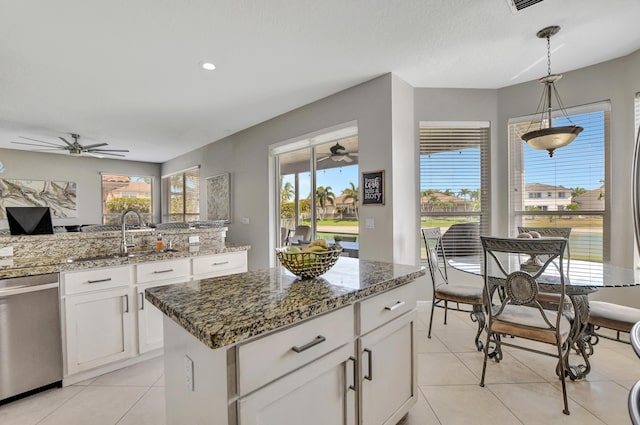 12774 Spikerush Cir, Boca Raton, FL 33428 - kitchen featuring dishwasher, white cabinetry, a ceiling fan, and a sink