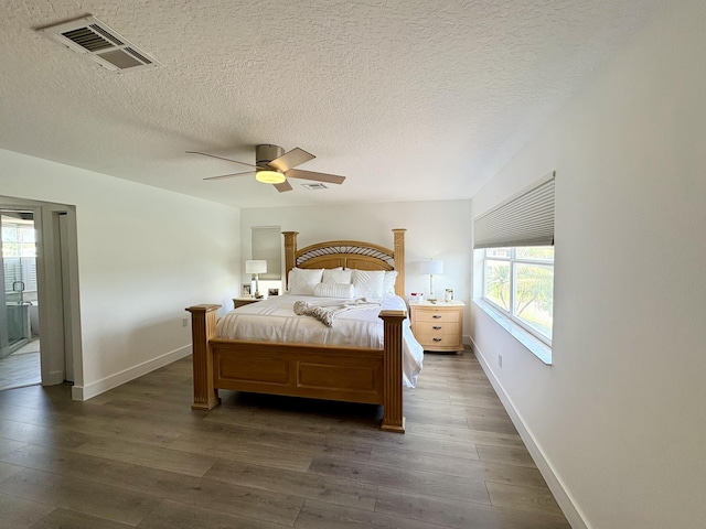 12774 Spikerush Cir, Boca Raton, FL 33428 - bedroom featuring a textured ceiling, visible vents, dark wood-style flooring, a ceiling fan, and baseboards