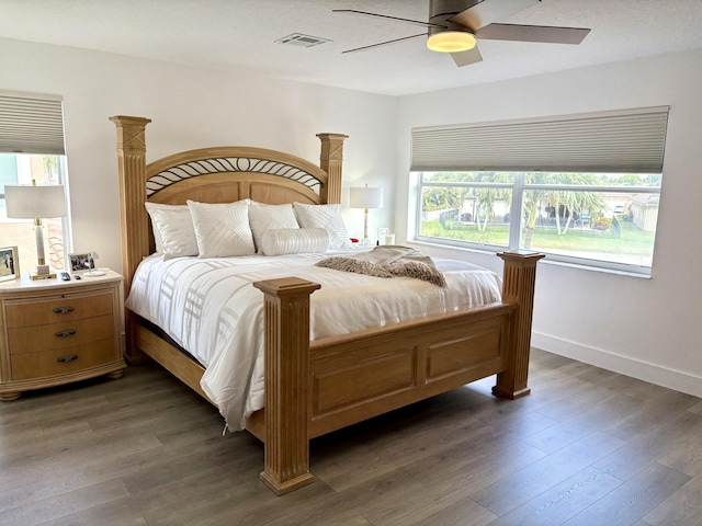12774 Spikerush Cir, Boca Raton, FL 33428 - bedroom featuring a ceiling fan, visible vents, wood finished floors, and baseboards