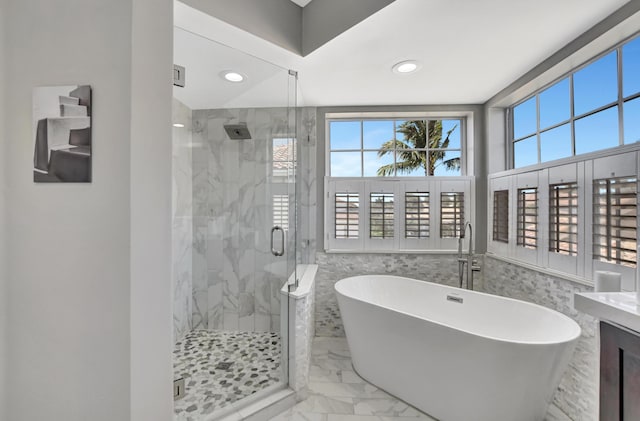 12774 Spikerush Cir, Boca Raton, FL 33428 - full bath with tile walls, marble finish floor, recessed lighting, a stall shower, and a soaking tub