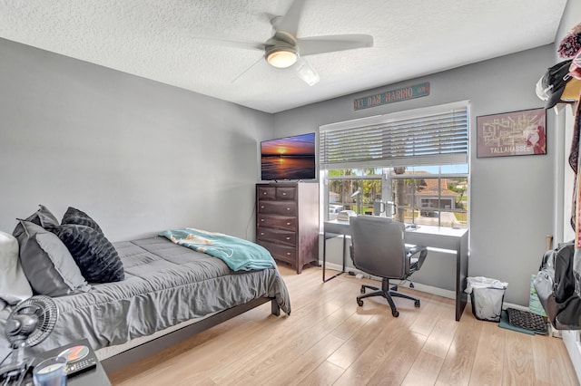 12774 Spikerush Cir, Boca Raton, FL 33428 - bedroom featuring ceiling fan, a textured ceiling, and wood finished floors