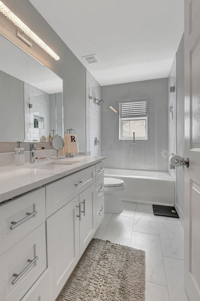 12774 Spikerush Cir, Boca Raton, FL 33428 - full bath featuring toilet, marble finish floor, visible vents, vanity, and bathtub / shower combination