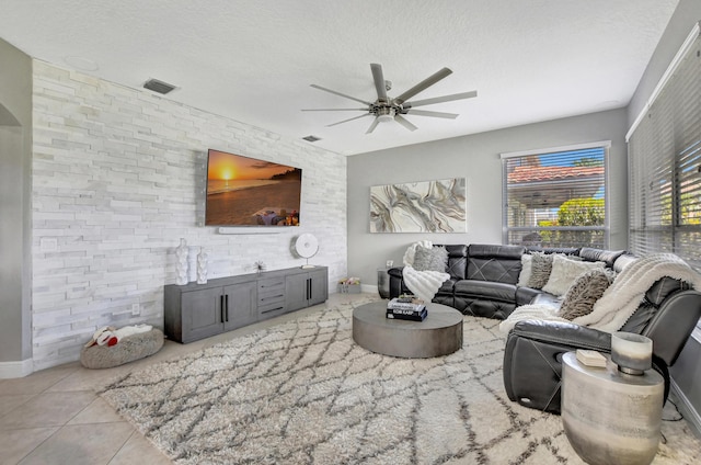 12774 Spikerush Cir, Boca Raton, FL 33428 - tiled living room with a ceiling fan, baseboards, visible vents, and a textured ceiling