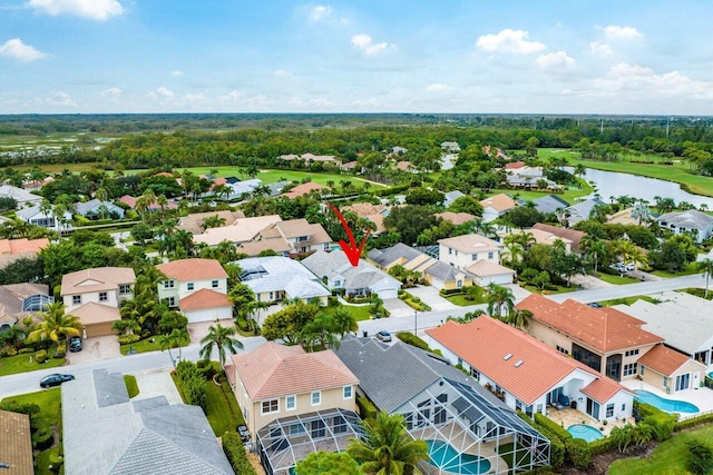 birds eye view of property featuring a water view and a residential view