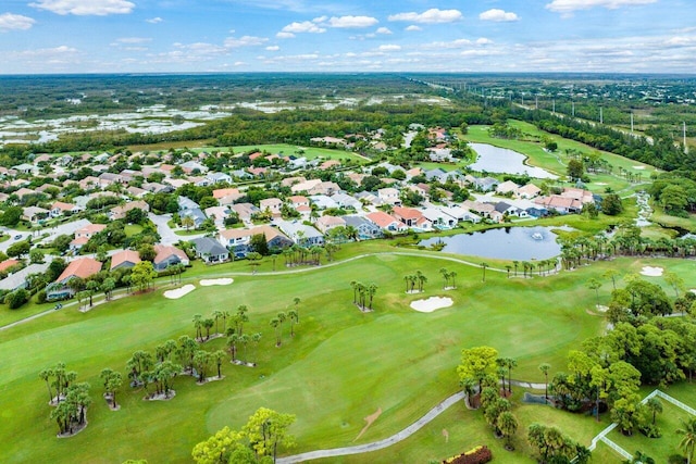 aerial view with a water view, golf course view, and a residential view
