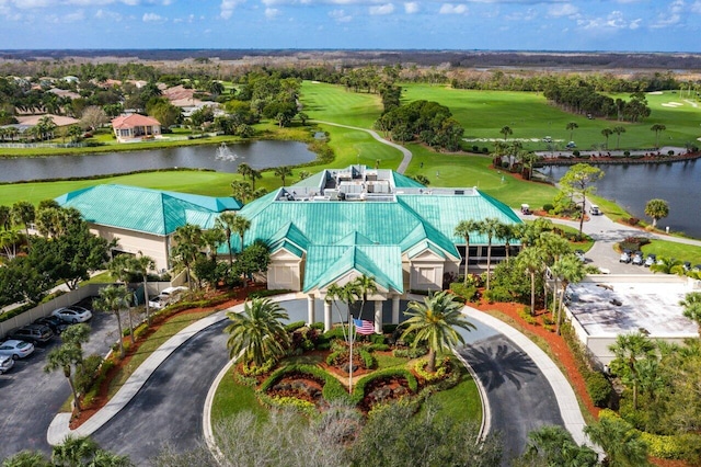 bird's eye view with a water view and golf course view