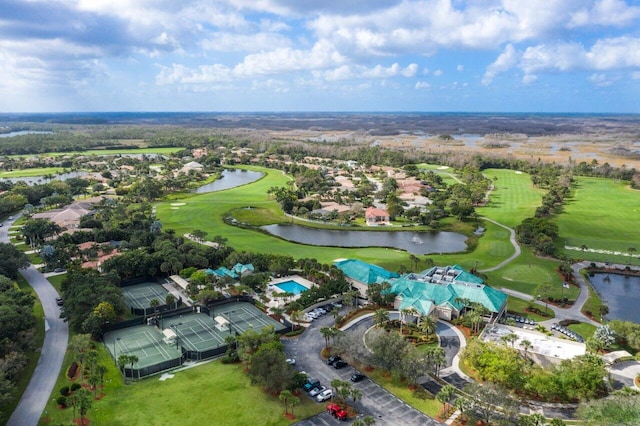 drone / aerial view featuring a water view, a residential view, and view of golf course