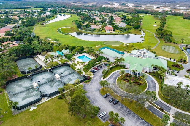 aerial view featuring a water view, a residential view, and view of golf course