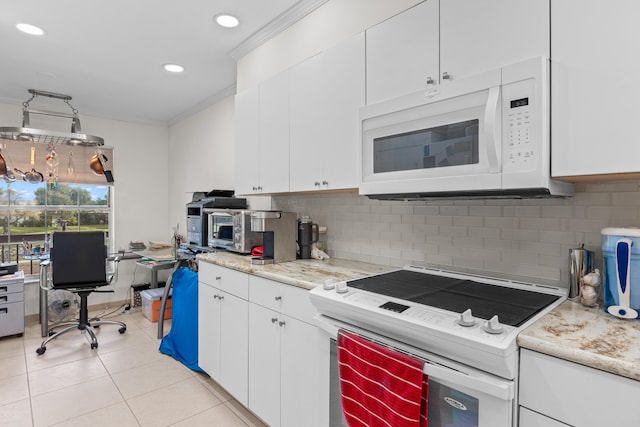 kitchen featuring ornamental molding, white appliances, light tile patterned flooring, white cabinetry, and backsplash