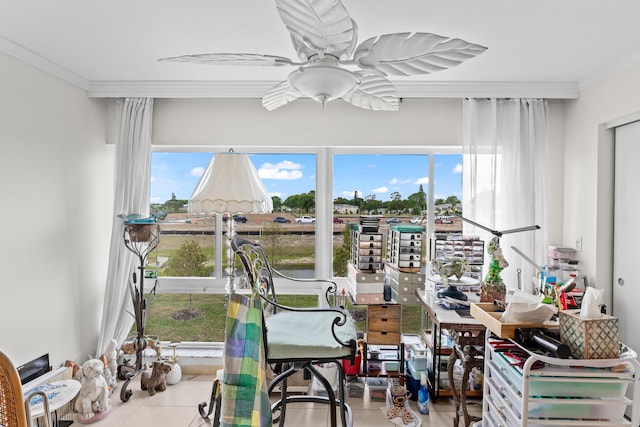 dining space featuring ceiling fan and crown molding