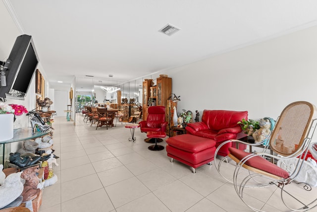 living area featuring light tile patterned floors and visible vents