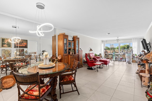 dining space with light tile patterned floors, crown molding, and a ceiling fan