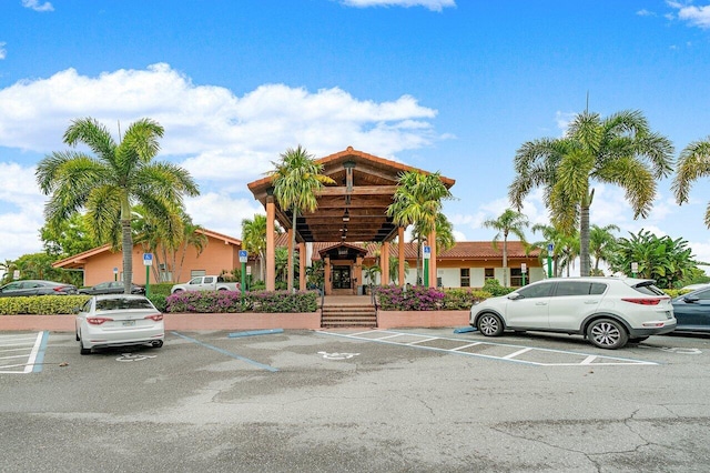 view of building exterior featuring uncovered parking