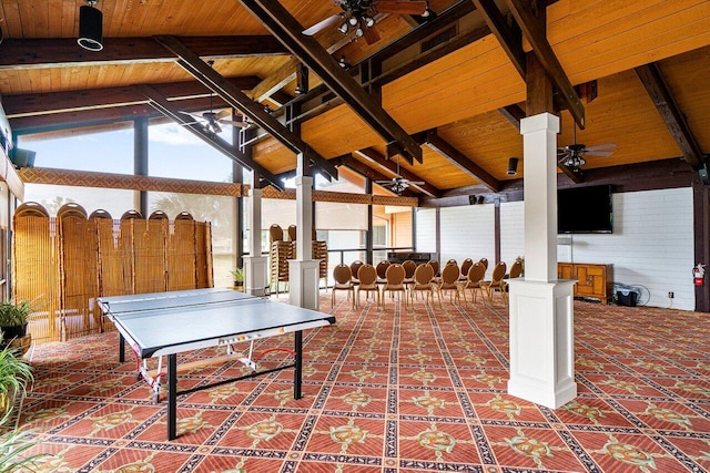 playroom featuring ceiling fan, wooden ceiling, a healthy amount of sunlight, and ornate columns