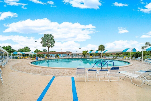 community pool with a patio area