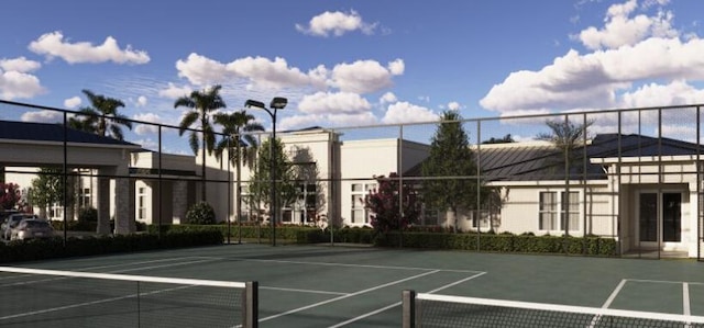 exterior space with community basketball court and fence