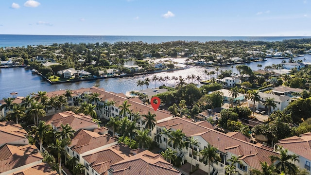 aerial view of residential area featuring a large body of water