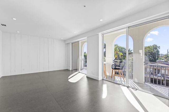 unfurnished room with healthy amount of natural light