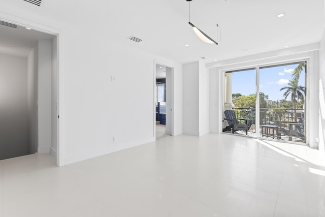 tiled spare room with recessed lighting and baseboards