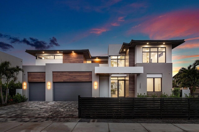 1445 NE 5th Ave, Boca Raton, FL 33432 - contemporary house featuring stucco siding, driveway, a garage, and a balcony