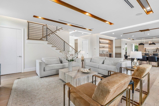 1445 NE 5th Ave, Boca Raton, FL 33432 - living area with light wood finished floors, stairway, baseboards, and recessed lighting