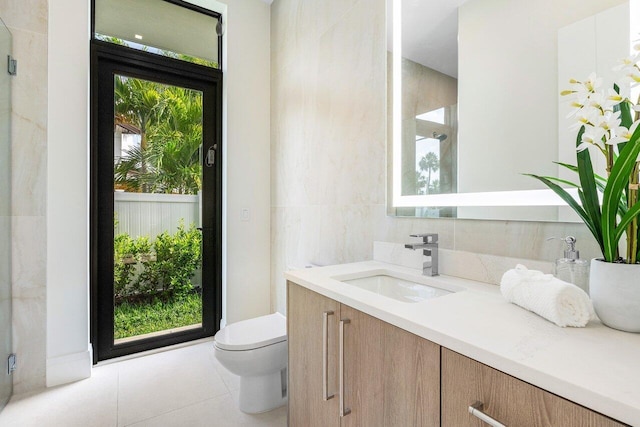 1445 NE 5th Ave, Boca Raton, FL 33432 - full bath featuring healthy amount of natural light, toilet, vanity, and tile patterned flooring
