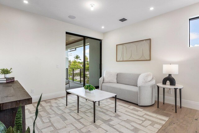 1445 NE 5th Ave, Boca Raton, FL 33432 - living room featuring light wood-type flooring, baseboards, and recessed lighting