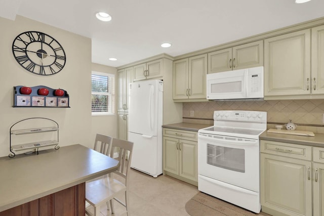 10200 S Ocean Dr Unit 303, Jensen Beach, FL 34957 - kitchen featuring white appliances and cream cabinetry