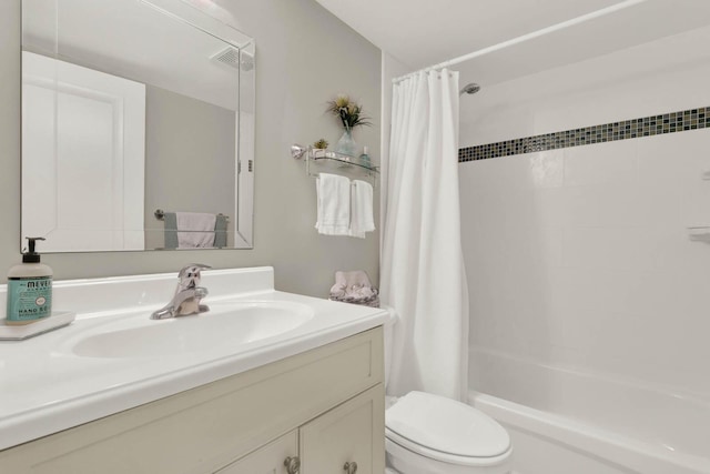 10200 S Ocean Dr Unit 303, Jensen Beach, FL 34957 - full bathroom featuring toilet, shower / bath combo with shower curtain, vanity, and visible vents