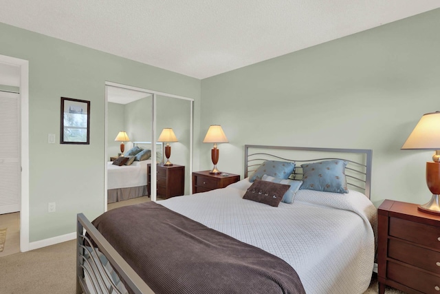 10200 S Ocean Dr Unit 303, Jensen Beach, FL 34957 - bedroom featuring carpet flooring, baseboards, and a closet