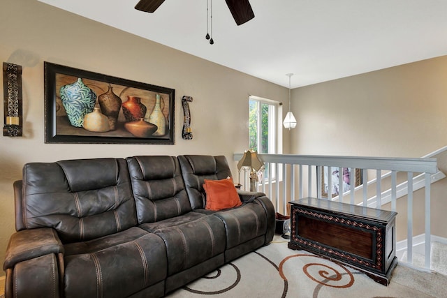 2125 Oakmont Dr, Riviera Beach, FL 33404 - living room with carpet flooring, baseboards, and a ceiling fan