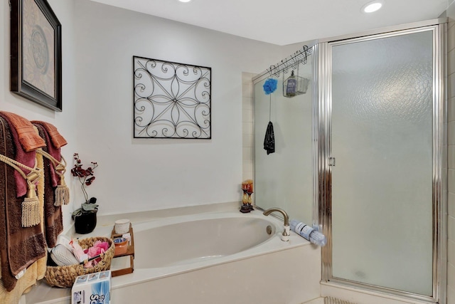 2125 Oakmont Dr, Riviera Beach, FL 33404 - bathroom featuring a garden tub, a stall shower, and recessed lighting
