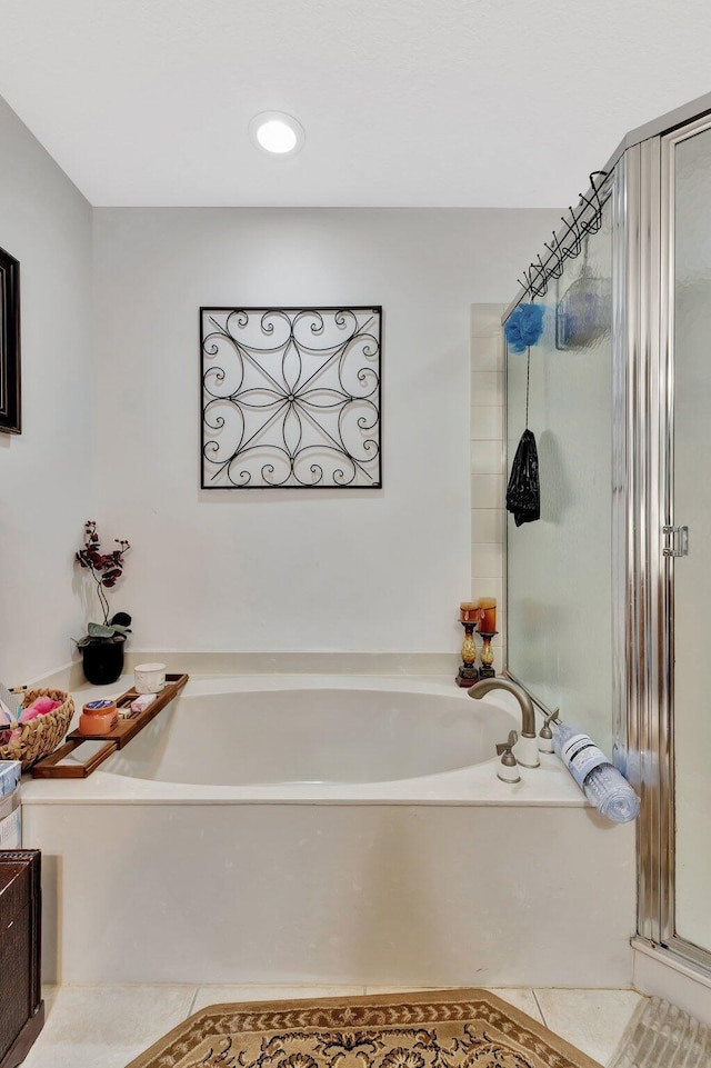 2125 Oakmont Dr, Riviera Beach, FL 33404 - full bathroom featuring tile patterned floors, a bath, and a stall shower