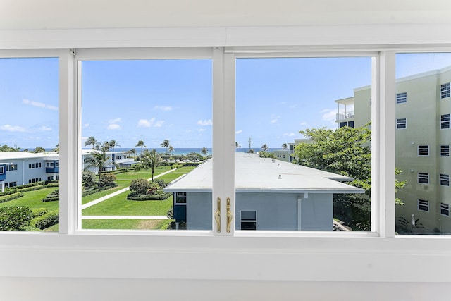 unfurnished sunroom with a water view