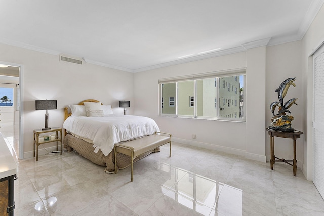 bedroom with crown molding and baseboards