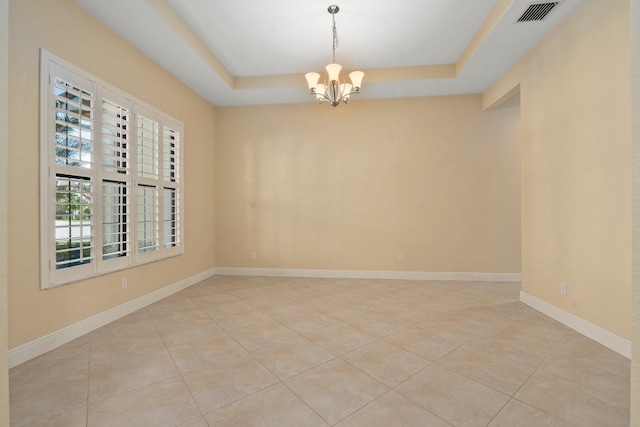unfurnished room featuring light tile patterned floors, a raised ceiling, a chandelier, and visible vents
