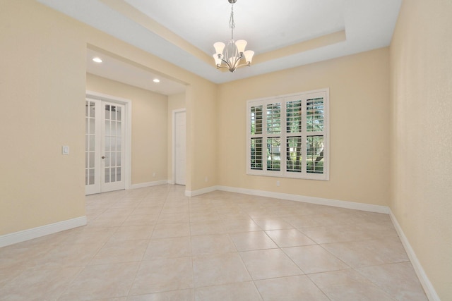 unfurnished room with french doors, recessed lighting, light tile patterned floors, baseboards, and a chandelier