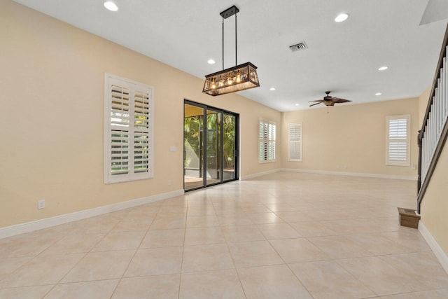 empty room featuring light tile patterned flooring, a ceiling fan, visible vents, and recessed lighting