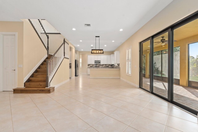 interior space with visible vents and stairway