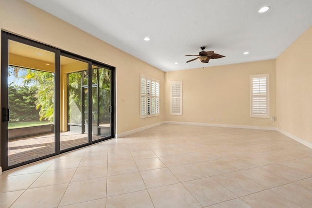 spare room with light tile patterned floors, baseboards, a ceiling fan, and recessed lighting