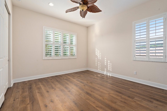 unfurnished bedroom featuring a closet, recessed lighting, baseboards, ceiling fan, and dark wood-style floors
