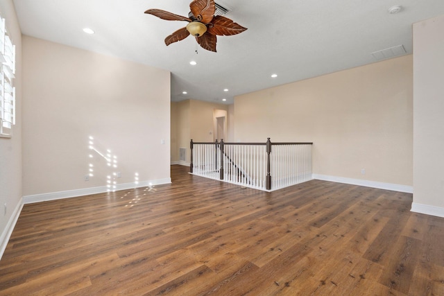 unfurnished room featuring ceiling fan, recessed lighting, baseboards, and wood finished floors