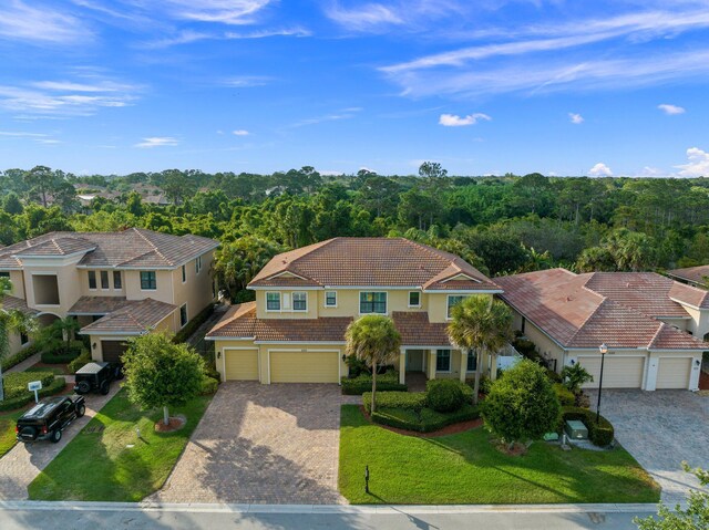 aerial view featuring a wooded view