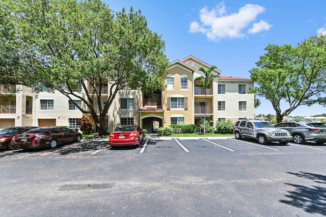 4240 San Marino Blvd Unit 108, West Palm Beach, FL 33409 - view of property featuring uncovered parking