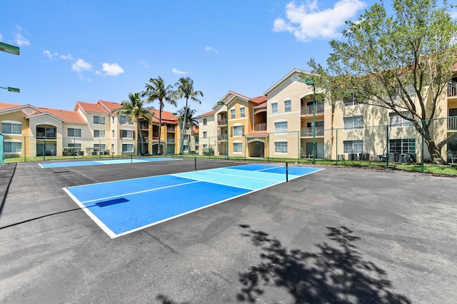 4240 San Marino Blvd Unit 108, West Palm Beach, FL 33409 - view of community featuring a tennis court and a residential view