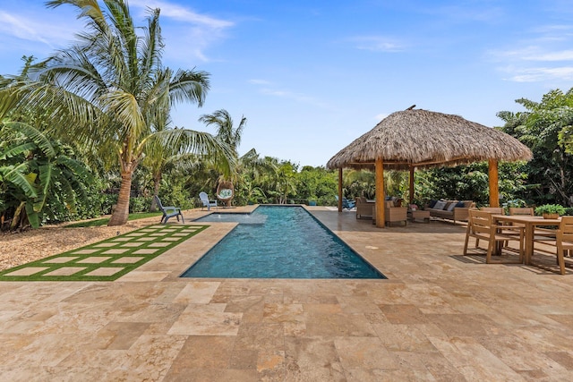 outdoor pool with a patio, a gazebo, and an outdoor living space