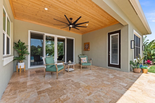 view of patio featuring a ceiling fan